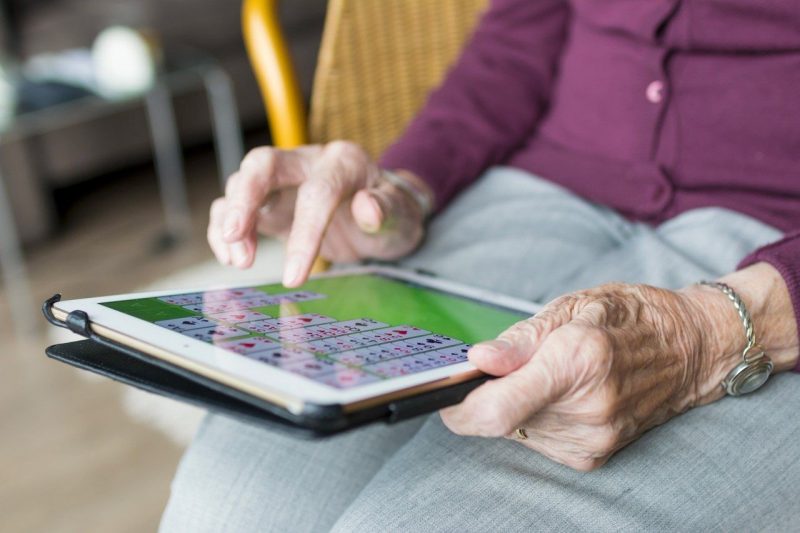 Older woman holding tablet