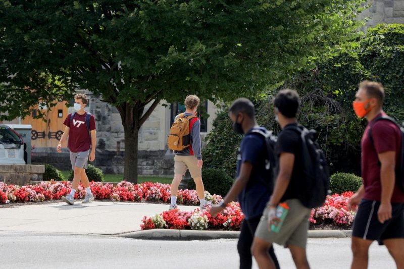 Students walk on campus during the first day of classes on Aug. 24