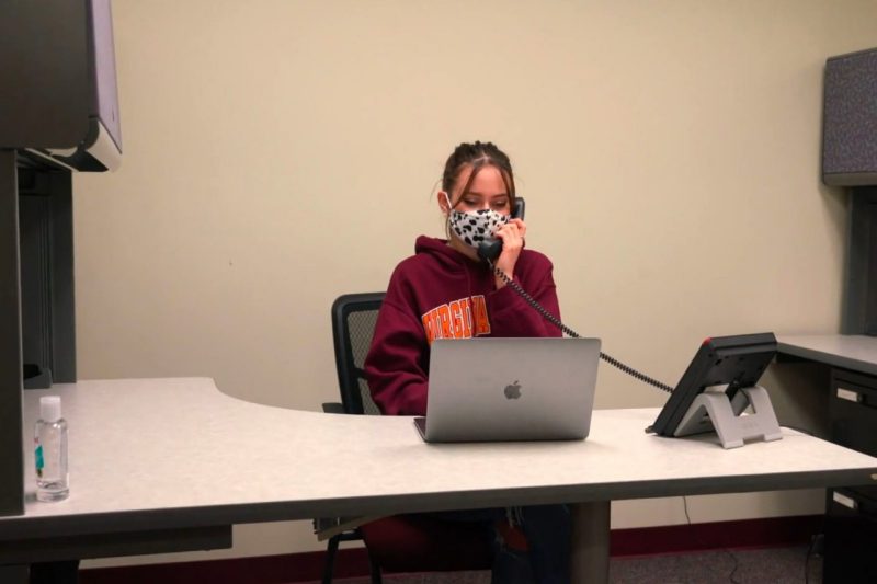 Anne Scyrkels, a Virginia Tech student, on the phone at the university's COVID-19 call center.