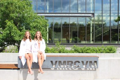 Lydia and Ann Carpenter sit in front of the VMCVM.