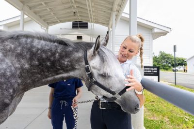 Horse and owner sharing a moment at the EMC.